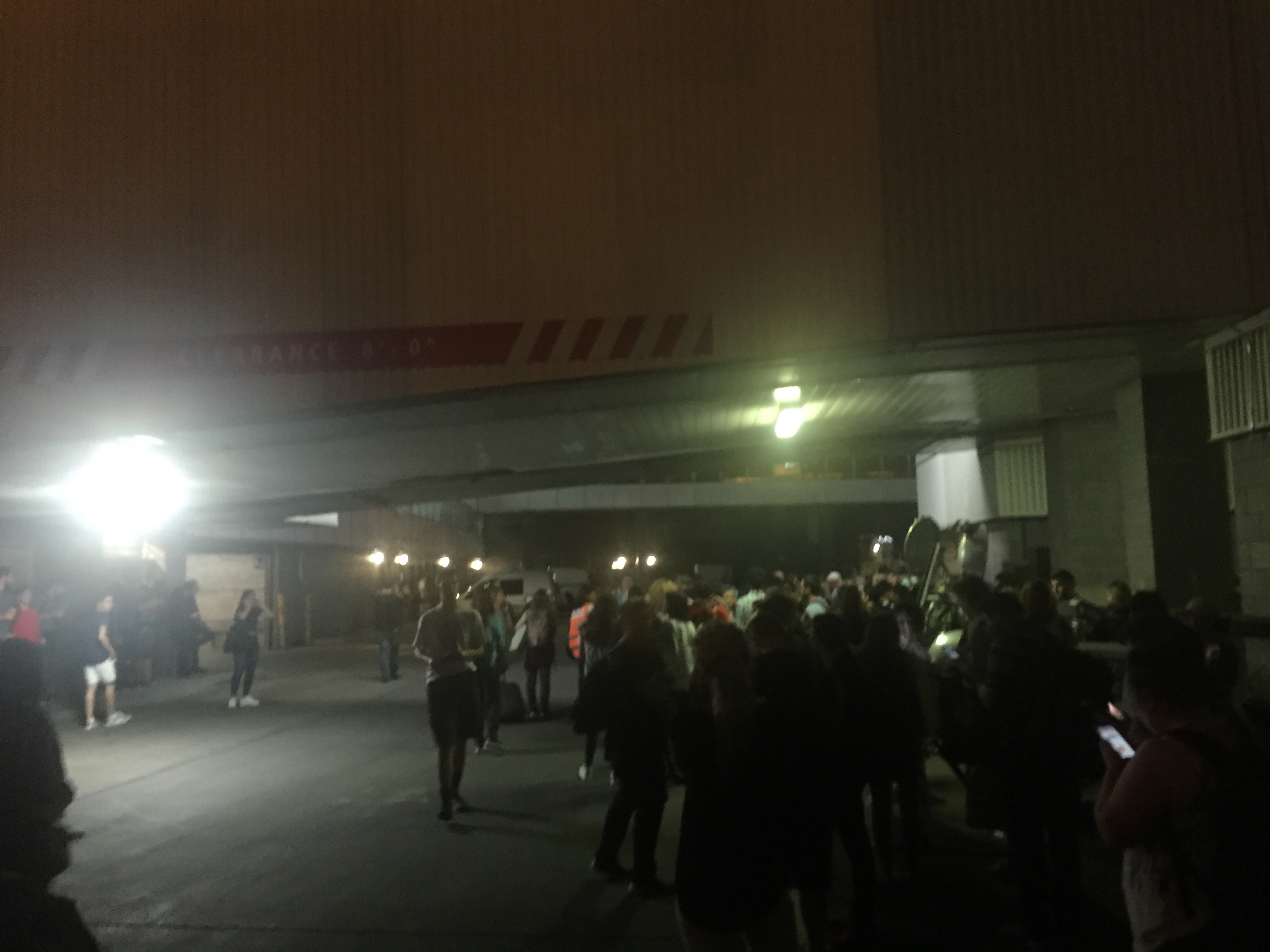 The crowd under an overpass